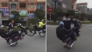 Bốc đầu xe máy, quái xế té đập đầu xuống đường