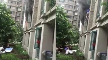 Thót tim khoảnh khắc cha thả con gái từ tầng 3 căn hộ đang cháy