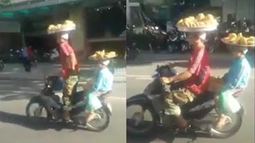 Đi xe máy đội mẹt bánh trên đầu, hai bố con khiến dân mạng sửng sốt