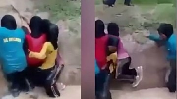 Clip ép nữ sinh nhảy xuống hố bùn đầy rắn gây phẫn nộ