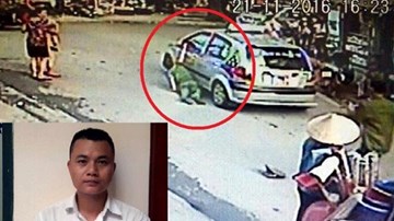 Taxi kéo lê thiếu tá công an trên phố