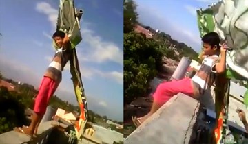 Đứa trẻ liều bay từ mái nhà với diều tự chế