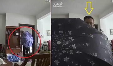 Tên trộm 'vui tính' dùng ô che mặt, trốn camera an ninh