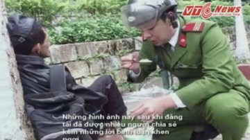 Chiến sĩ cảnh sát đút từng thìa thức ăn cho người lang thang