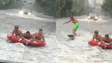 Dân Mỹ rủ nhau ra đường bơi phao, lướt sóng giữa 'siêu bão thập kỷ'