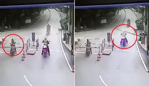 Mải ngắm gái xinh, bị barie đập trúng đầu ngã lăn ra đất