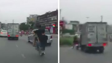 Hai quái xế bốc đầu xe máy, bị ôtô tải quệt văng vào dải phân cách