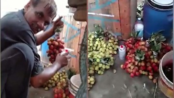 Du khách choáng váng bắt gặp người bán hàng phun sơn lên chùm nho cho đẹp