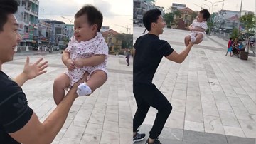 Quốc Nghiệp nâng con gái 3 tháng tuổi bằng một tay gây sốt