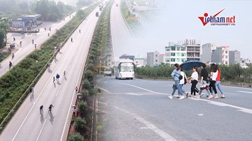 Bắc Giang: Công nhân 'đùa với tử thần' lũ lượt băng qua cao tốc đi làm