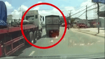 Xe tải chuyển làn ẩu làm gãy gương xe container rồi bỏ chạy