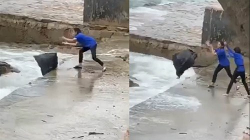 Làm rõ vụ nhân viên quán cà phê ném từng bọc rác xuống biển gây bức xúc