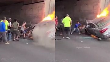 Dân dùng máy cắt giải cứu 2 người trong ô tô tông gầm cầu, bốc cháy dữ dội