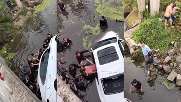 Hàng chục người hợp sức lật ô tô trên sông để giải cứu người bị kẹt