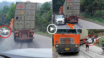 Xe container ôm cua khi xuống dốc khiến ô tô con nát đầu