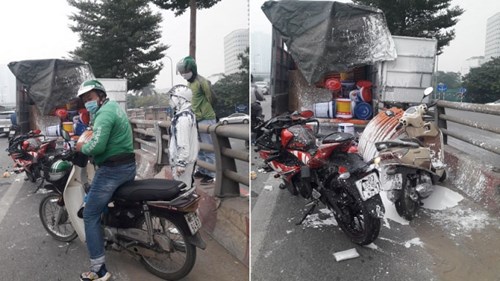 Mô tô vượt ẩu tông vào xe chở sơn khiến cô gái ‘trắng’ từ đầu tới chân