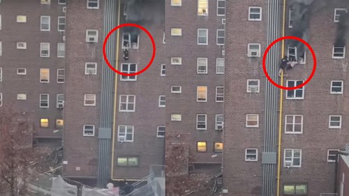 Hai chị em đu ống nước bên ngoài tòa nhà thoát khỏi căn hộ đang cháy lớn